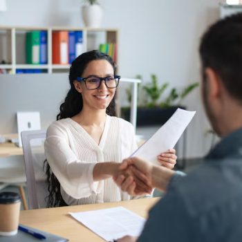 smiling-female-personnel-manager-job-applicant-shaking-hands-after-successful-employment_116547-20031